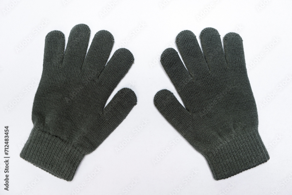 Warm winter childrens gloves mittens made of acrylic and wool on white background isolate Warm winter childrens gloves mittens made of acrylic and wool on white background isolate