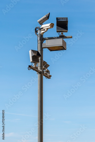 Security camera on the public road. Video surveillance and lighting systems.Surveillance with security cameras on the street for the safety of citizens.