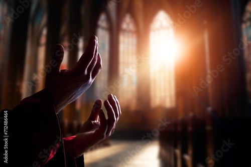 Hand of  muslim praying person with mosque interior photo