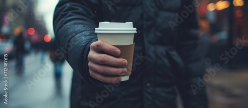 Person with a coffee to go photo