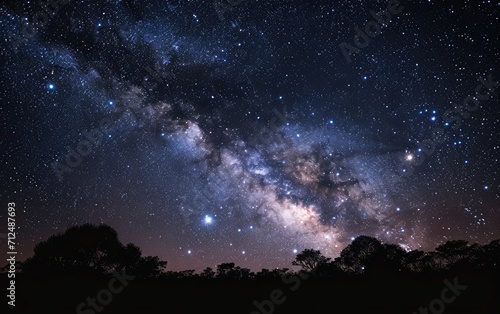 The night sky is filled with twinkling stars and the Milky Way galaxy © AZ Studio