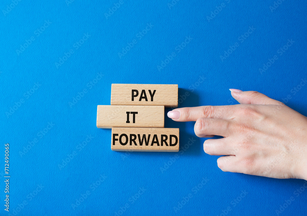 Pay it forward symbol. Concept words Pay it forward on wooden blocks ...