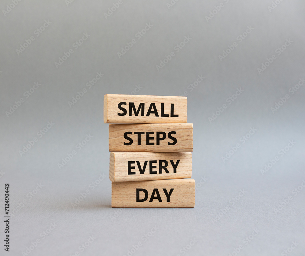 Small Steps Every Day symbol. Wooden blocks with words Small Steps Every Day. Beautiful grey background. Business and Small Steps Every Day concept. Copy space. Small Steps Every Day symbol. Wooden blocks with words Small Steps Every Day. Beautiful grey background. Business and Small Steps Every Day concept. Copy space.