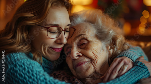 close-up adult daughter embracing elderly mother at home, love care unconditional love concept