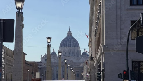 Breathtaking panoramic establishing cinematic shot of Rome St. Peter's Basilica with scene of the Via della Conciliazione street in Vatican, Rome, Italy photo
