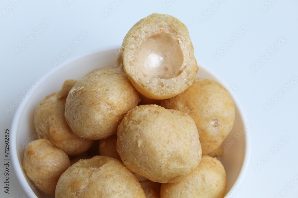 Bitten fish crackers in ball shape. isolated on white background Bitten fish crackers in ball shape. isolated on white background