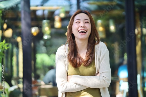 Free Download portrait of a smiling woman in cafe - GFXLoad
