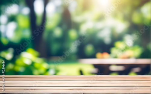 Abstract clear wooden worktop for a product montage featuring copy space above a summer and springtime blurred background display 