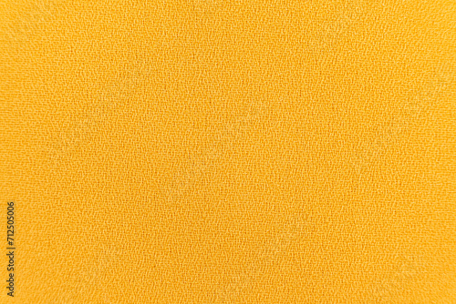 Polyester synthetic fabric top view, macro fiber yellow fabric