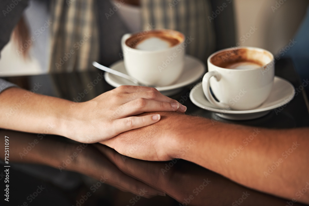 Love, coffee shop and couple holding hands, relax and romantic support on morning date for latte, espresso or beverage. Relationship, hospitality service and closeup of people bonding over drink cup Love, coffee shop and couple holding hands, relax and romantic support on morning date for latte, espresso or beverage. Relationship, hospitality service and closeup of people bonding over drink cup