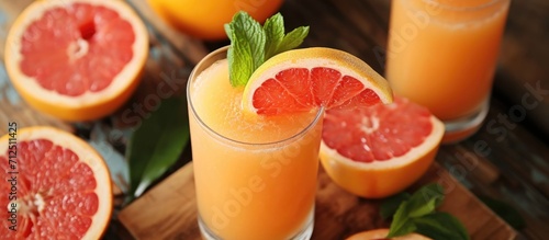 Making citrus-infused juice with squeezed grapefruits promotes a healthy lifestyle.