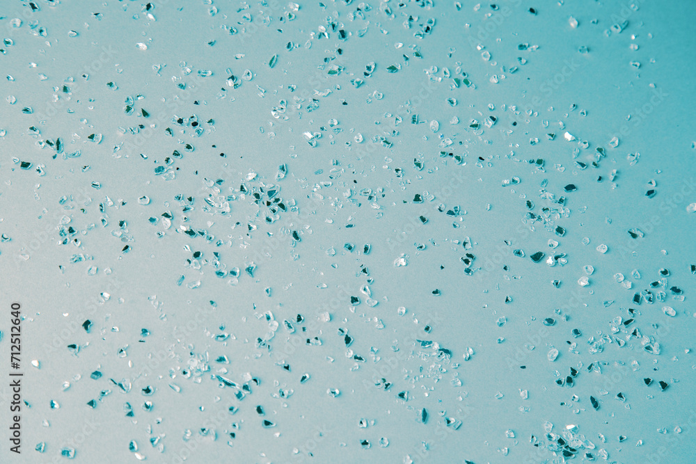 little shards of glass on cyan background little shards of glass on cyan background