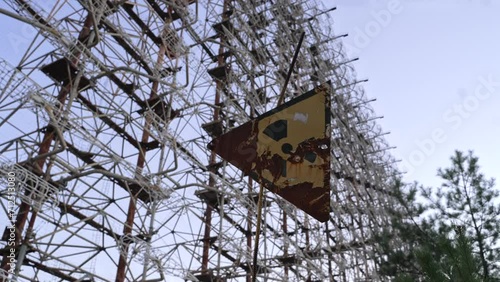 View of Duga horizon radar systems through radiation sign, Chernobyl, Ukraine