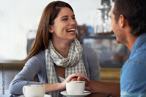 Relax couple, coffee shop and woman laughing over funny joke, conversation or romantic date in diner, cafe or restaurant. Relationship humour, comedy and cafeteria people bonding over espresso drinks photo