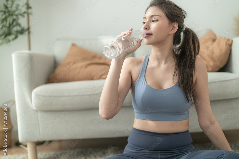 close up of Young face caucasian fitness woman wearing sport clothes training indoor drinking fresh water. healthy lifestyle and wellness. close up of Young face caucasian fitness woman wearing sport clothes training indoor drinking fresh water. healthy lifestyle and wellness.