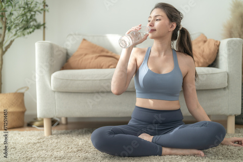 close up of Young face caucasian fitness woman wearing sport clothes training indoor drinking fresh water. healthy lifestyle and wellness.