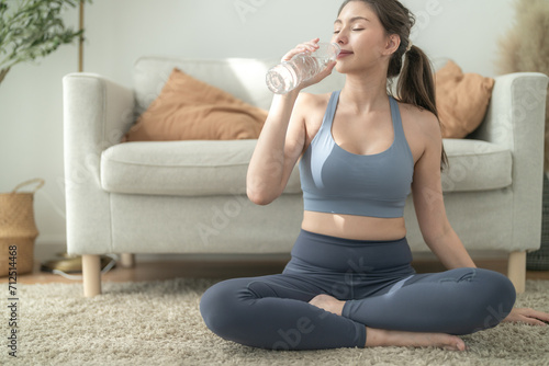 close up of Young face caucasian fitness woman wearing sport clothes training indoor drinking fresh water. healthy lifestyle and wellness.