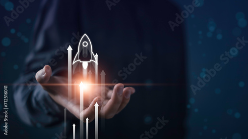 Business start up, start, new project, new idea concept. Businessman hold on rocket launch with arrow Leadership business strategy for goal target success.
