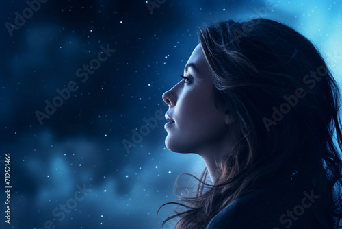 Sad female profile on stars sky background, toned image 