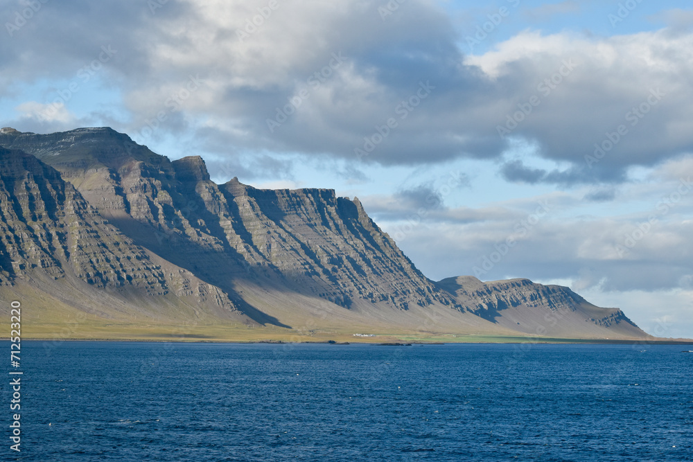 A rugged, grooved, dramatic coastline in Iceland