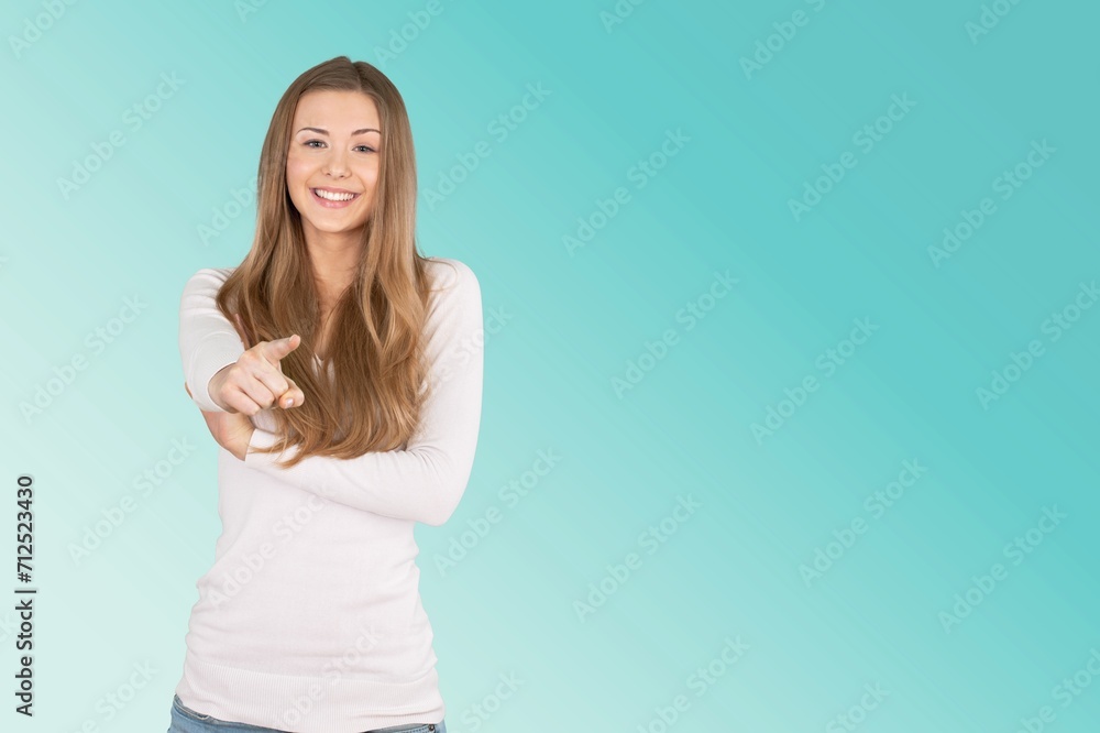 pretty young woman standing on blue background pretty young woman standing on blue background