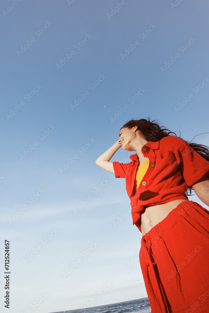Joyful Woman Dancing on the Beach, Smiling with Freedom and Emotion Joyful Woman Dancing on the Beach, Smiling with Freedom and Emotion