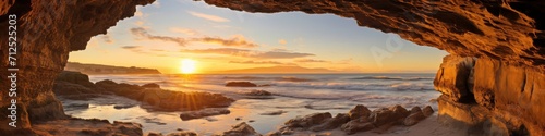 A coastal arch panorama at golden hour, with warm sunlight illuminating the natural stone formation