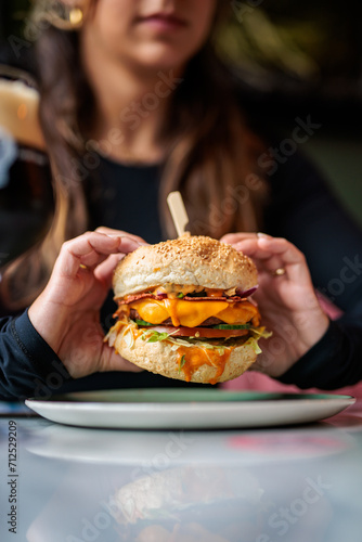 woman holding vegan burger 