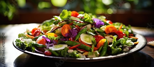 Mixed greens and vegetables in a salad.