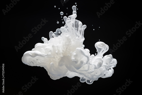 diffusion of a drop of white ink in water in shape of a floating cloud on black background