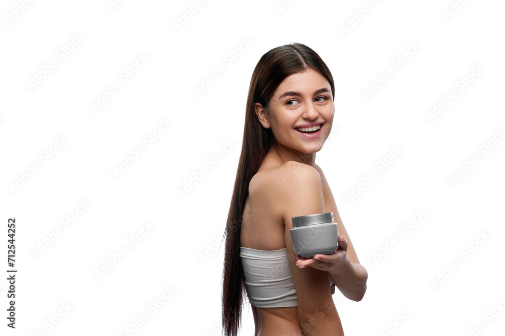 Young beautiful lady presenting jar of skin care cosmetic product and looking over shoulder against white background. Concept of organic beauty cosmetic, spa procedures, body care. Young beautiful lady presenting jar of skin care cosmetic product and looking over shoulder against white background. Concept of organic beauty cosmetic, spa procedures, body care.