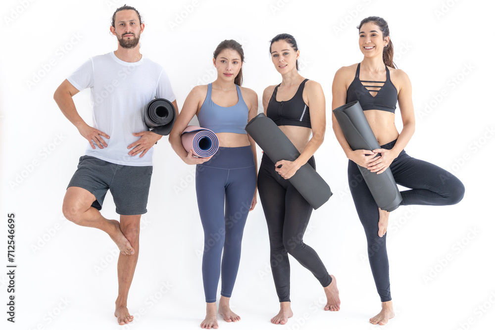 Group of happy sporty women and guy wearing body stylish sportswear holding personal carpets leaned on a white background. waiting for yoga class or body weight class. healthy lifestyle and wellness Group of happy sporty women and guy wearing body stylish sportswear holding personal carpets leaned on a white background. waiting for yoga class or body weight class. healthy lifestyle and wellness