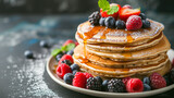 Stack of Pancakes with Fresh Berries and Syrup