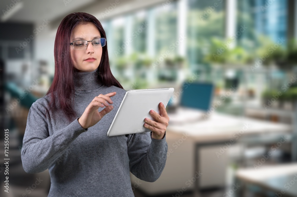 Smiling happy business woman using digital tablet Smiling happy business woman using digital tablet