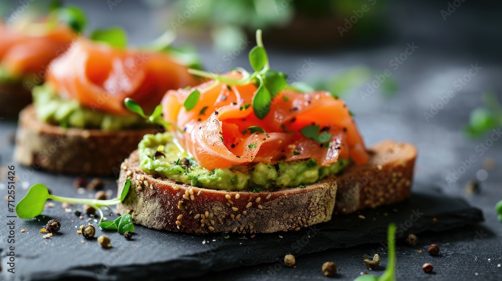 Open sandwiches with salted salmon, guacamole avocado and microgreens. Healthy food Open sandwiches with salted salmon, guacamole avocado and microgreens. Healthy food