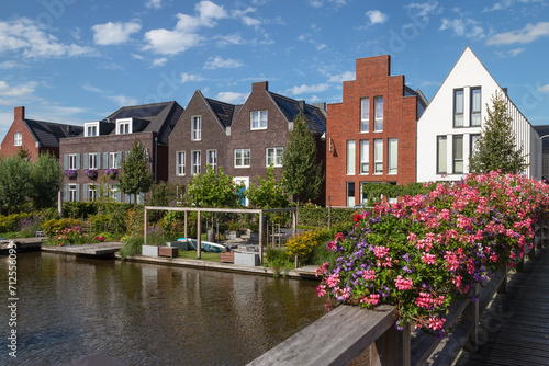 Modern houses along the canal in the new district of Vathorst in Amersfoort in the Netherlands. photo