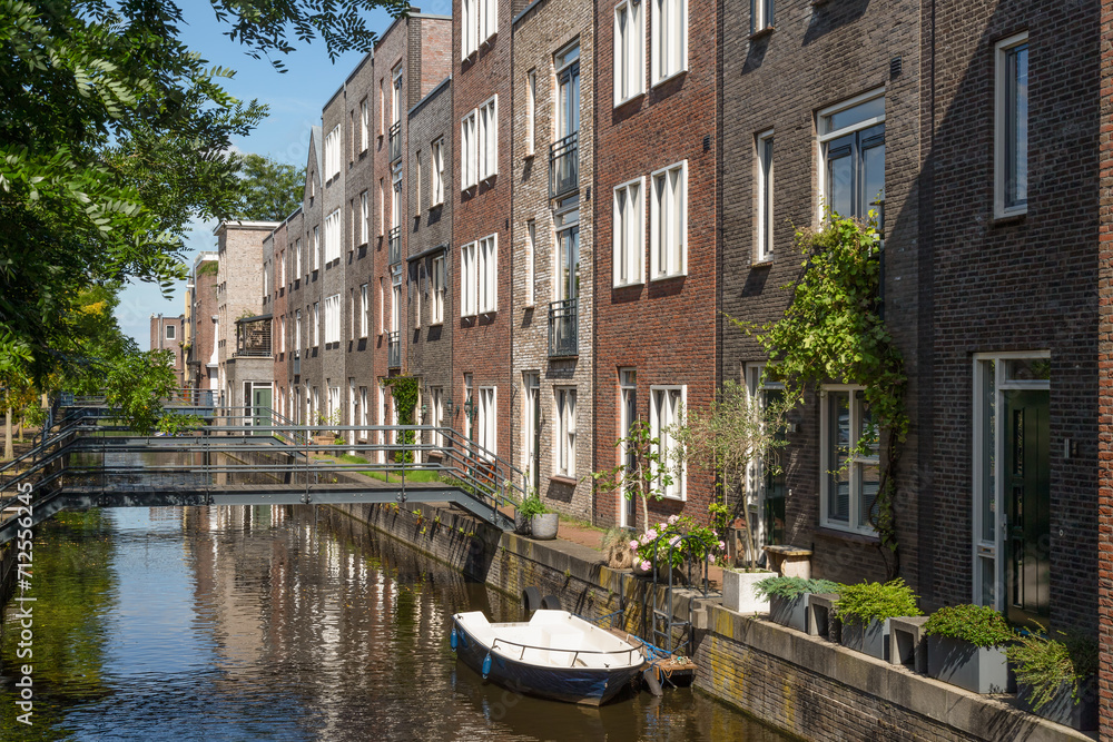 Modern houses with narrow metal bridges over the canal in the new Vathorst district in Amersfoort.