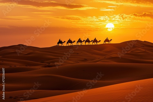 Silhouetted caravan of camels crossing desert at sunset.