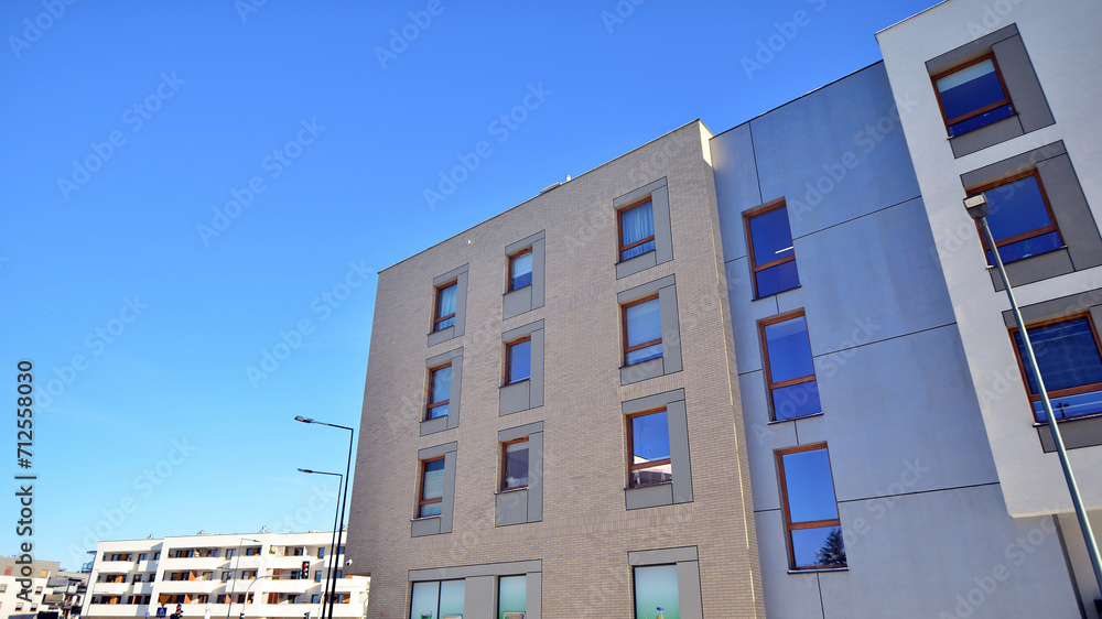 Modern apartment building in sunny day. Exterior, residential house facade. Residential area with modern, new and stylish living block of flats. Modern apartment building in sunny day. Exterior, residential house facade. Residential area with modern, new and stylish living block of flats.