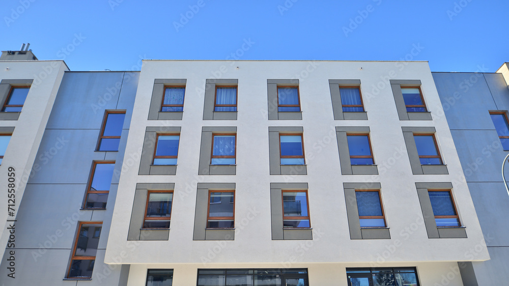 Modern apartment building in sunny day. Exterior, residential house facade. Residential area with modern, new and stylish living block of flats. Modern apartment building in sunny day. Exterior, residential house facade. Residential area with modern, new and stylish living block of flats.