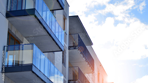 Modern apartment building in sunny day. Exterior, residential house facade. Residential area with modern, new and stylish living block of flats. 