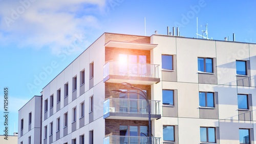 Modern apartment building in sunny day. Exterior, residential house facade. Residential area with modern, new and stylish living block of flats. 
