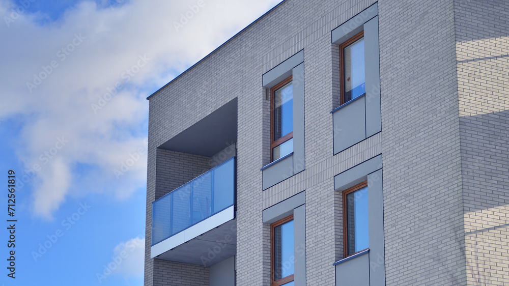Modern apartment building in sunny day. Exterior, residential house facade. Residential area with modern, new and stylish living block of flats. Modern apartment building in sunny day. Exterior, residential house facade. Residential area with modern, new and stylish living block of flats.
