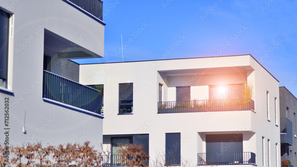 Modern apartment building in sunny day. Exterior, residential house facade. Residential area with modern, new and stylish living block of flats. 