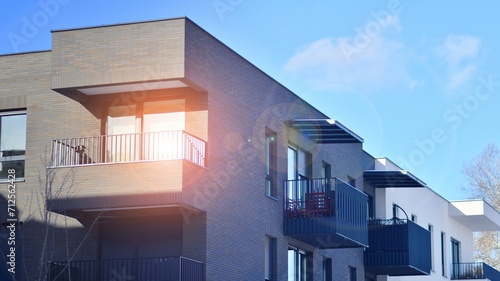 Modern apartment building in sunny day. Exterior, residential house facade. Residential area with modern, new and stylish living block of flats. 