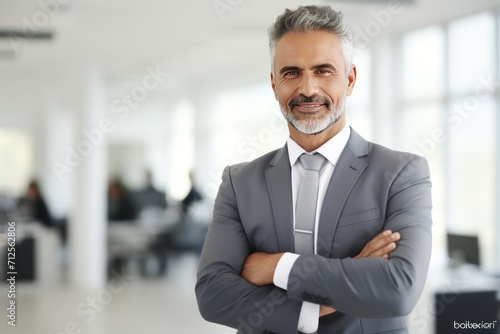 Indian businessman standing confidently at office