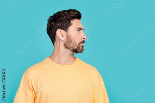 Side photo of boyfriend young guy brunet hair unshaven with bristle after barber shop hairdresser isolated over blue color background