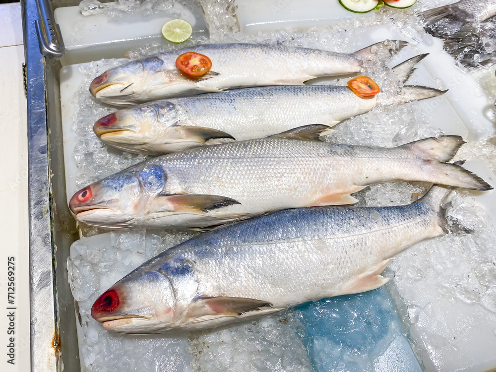 Red fish eyes. Not fresh frozen fourfinger threadfin fish with ice sold