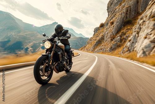A motorcyclist riding on a mountain road