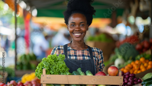 African American young woman owner in a vegetable store